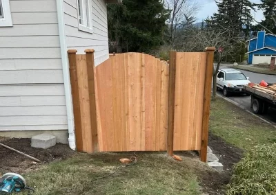 Wood fence with gate around house