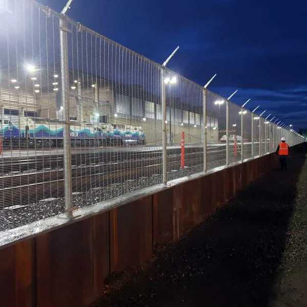 High security fence at Boeing at night