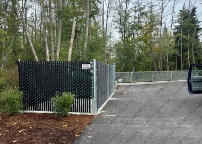 6' Black Viewguard Pre-Slatted Galvanized Chain Link Garbage Enclosure