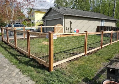 residential Cedar Deco mesh fence with custom round top gate