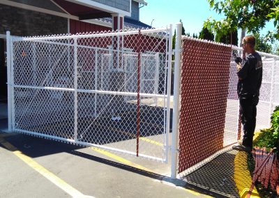 6 foot tall, white chain link with red slats commercial grade